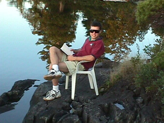 Reading on the Lake Temagami shoreline.